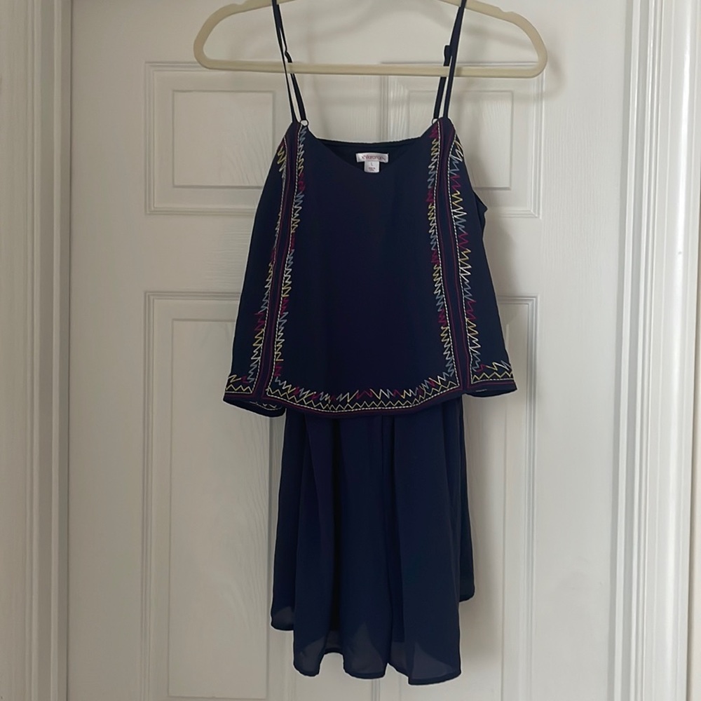 Blue romper with multi-colored detailed trim. Size large.